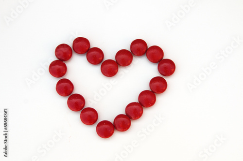 Red candy heart isolated on white background