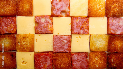 sqare slices of salsmi, bread, cheese photo