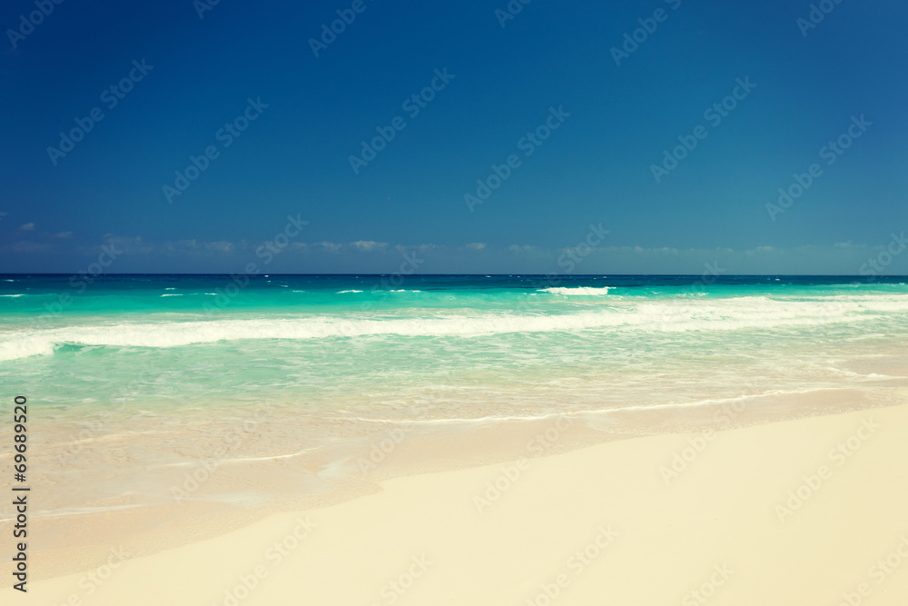 blue sea or ocean, white sand and sky