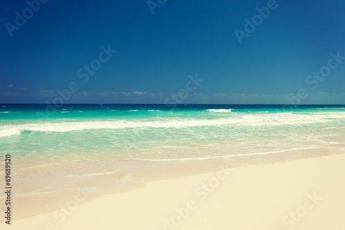 blue sea or ocean, white sand and sky