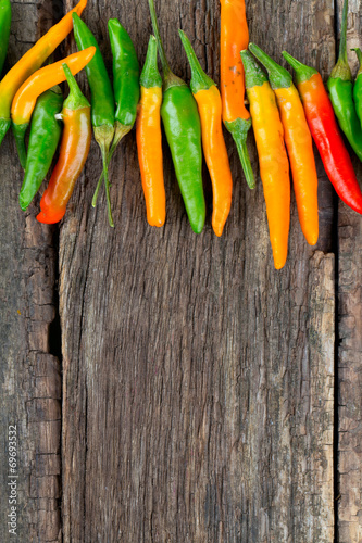 hot pepper on wooden surface