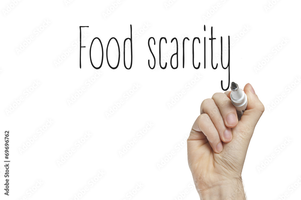 Fotografie Hand writing food scarcity