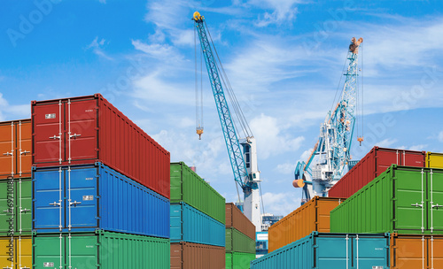 export or import shipping cargo container stacks and port cranes