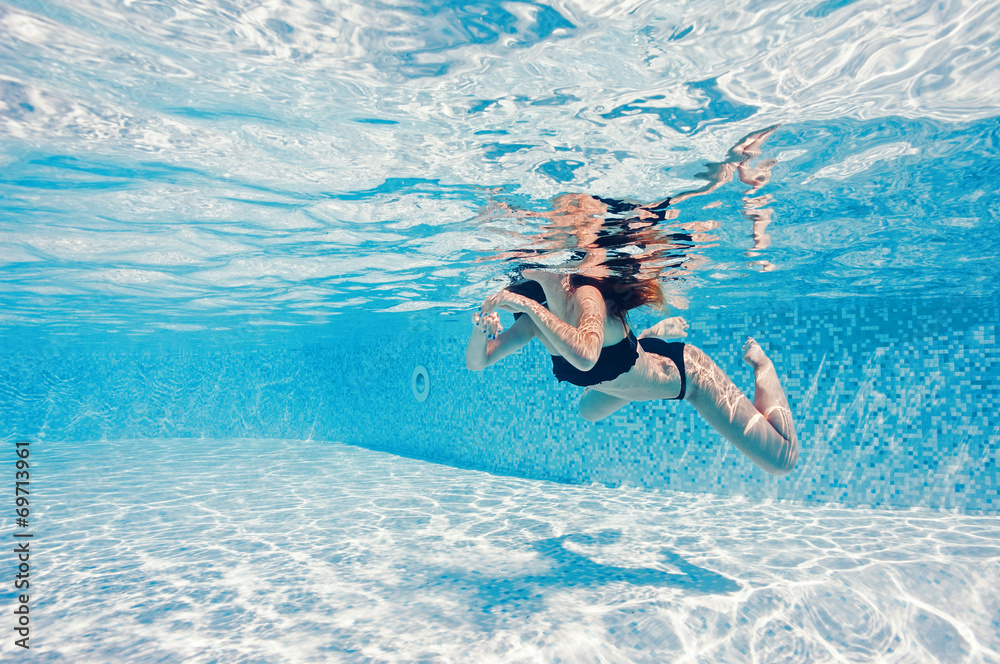 Underwater woman portrait wearing black bikini in swimming pool. Stock ...