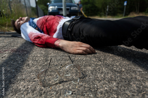 Dead man lying on the street