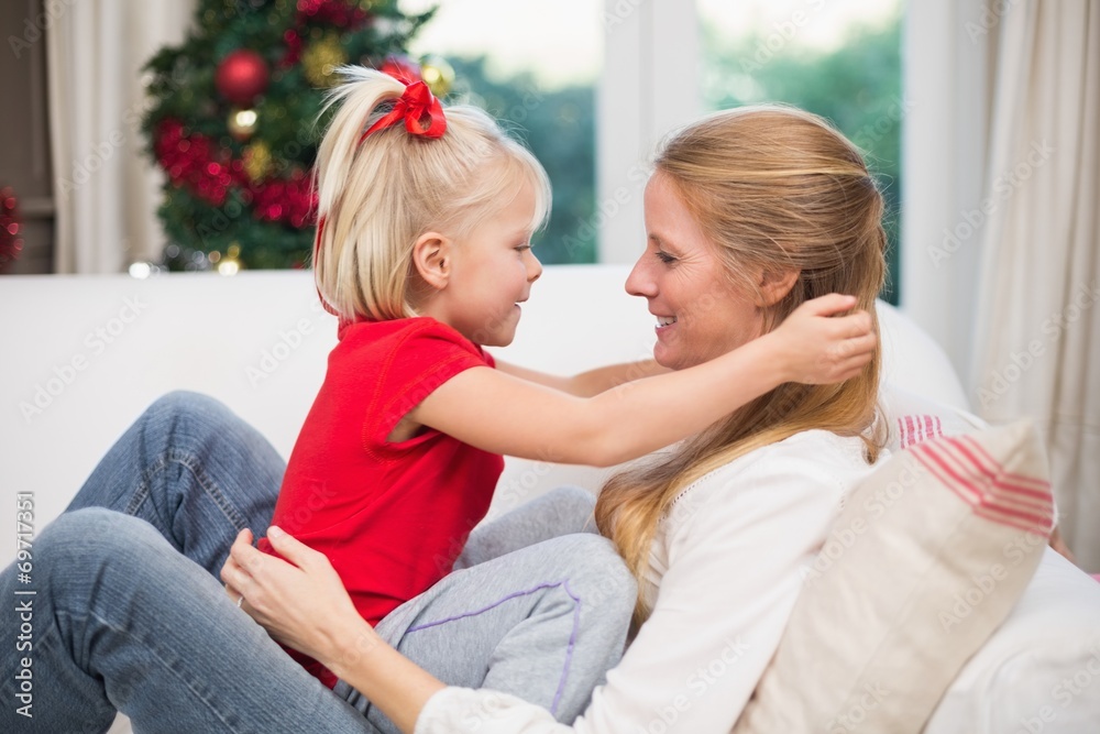 Cute daughter and mother celebrating christmas Cute daughter and mother celebrating christmas