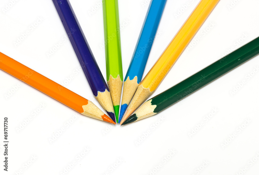 Colour pencils on white background close up Colour pencils on white background close up