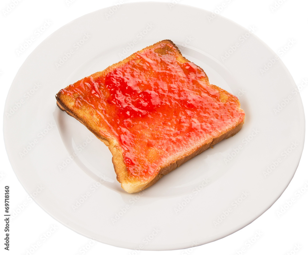 Bread toast with strawberry jam on white plate Bread toast with strawberry jam on white plate