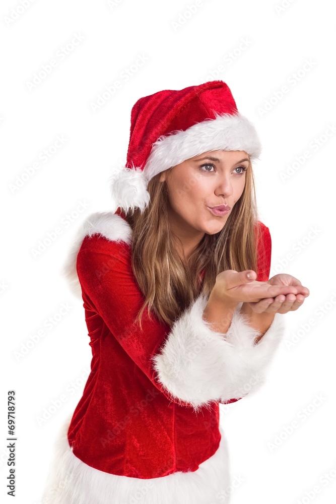 Festive blonde blowing over hands Festive blonde blowing over hands