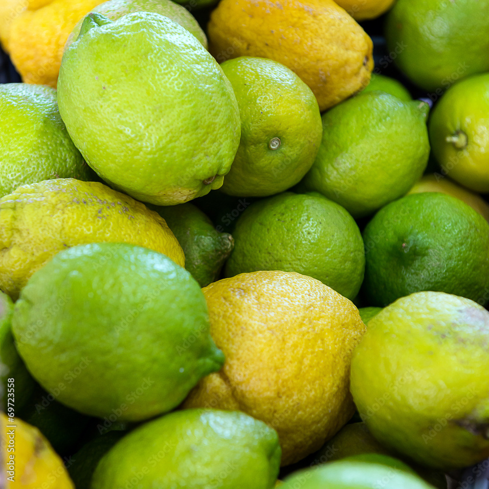 Green lemons in the market