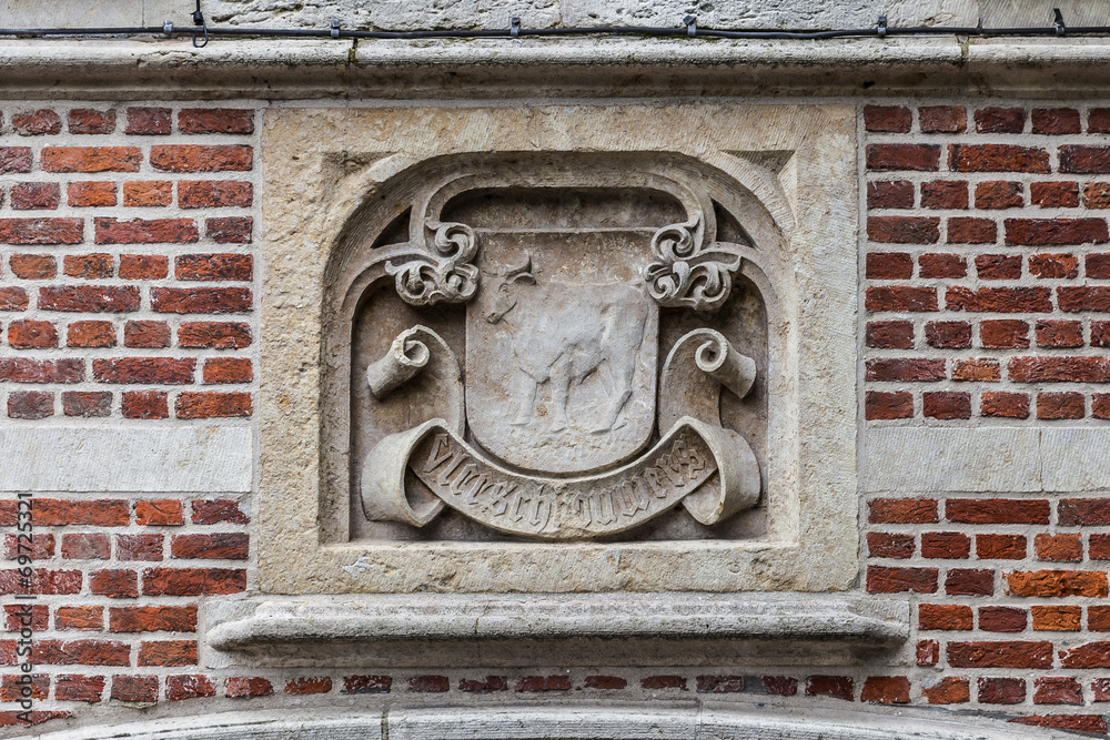 Old historical wall decor plate in Gent, Flanders, Belgium