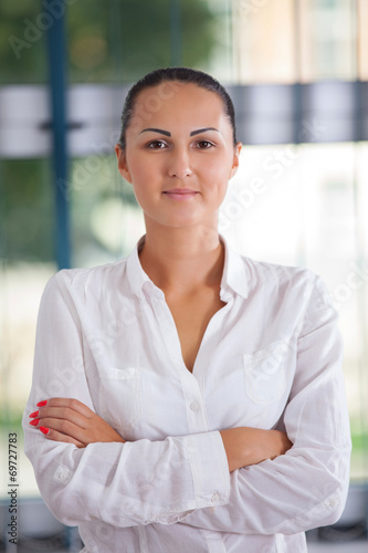 Successful business woman looking confident and smiling Free Download Successful business woman looking confident and smiling - GFXLoad