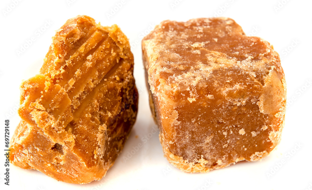Jaggery cane sugar isolated on white Jaggery cane sugar isolated on white