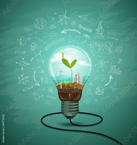 Green seedlings in a light bulb ecology concept