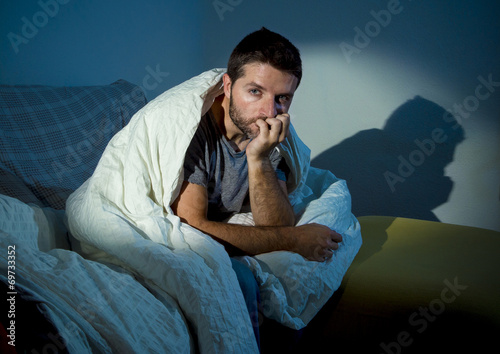 young sick man suffering insomnia disorder or depression