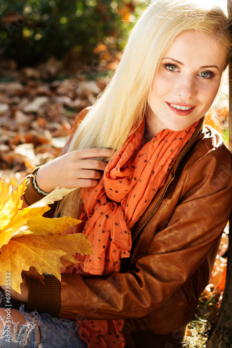 Nice blonde girl in autumn park