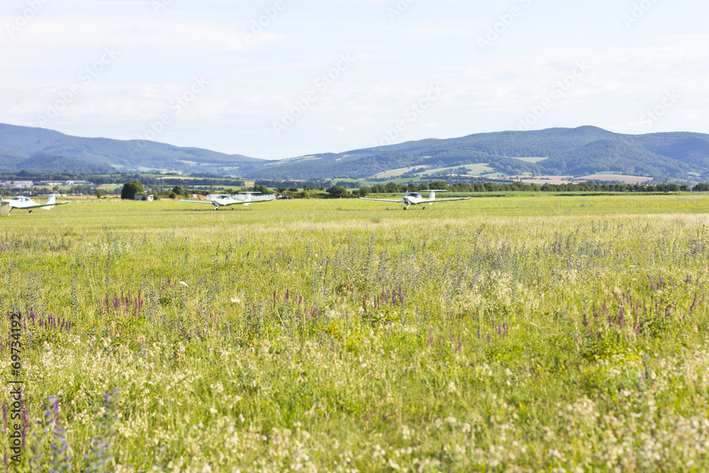 Fototapeta premium mountain landscape with a small plane in the background