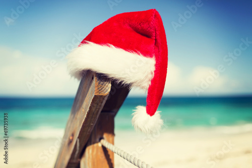 close up of santa helper hat on beach