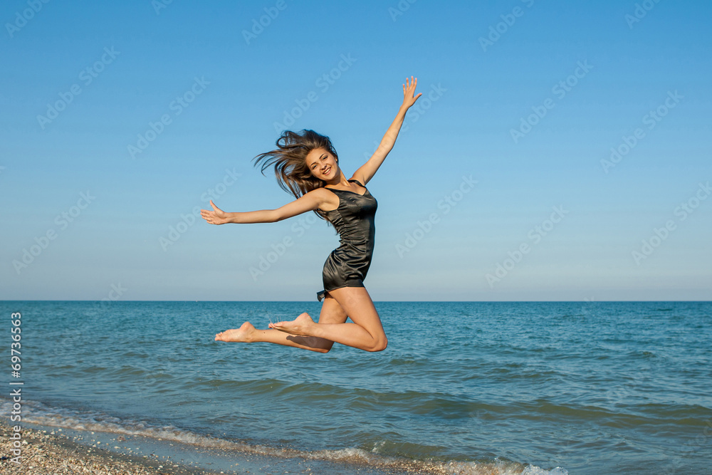 Young cheerful girl on the sea Young cheerful girl on the sea