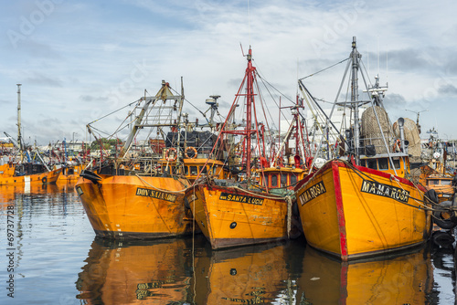 Orange fishing boats in Mar del Plata, Argentina photo