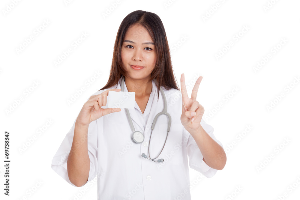 Asian young female doctor show victory sign with blank card Asian young female doctor show victory sign with blank card