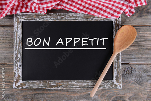 Bon appetit written on chalkboard, close-up