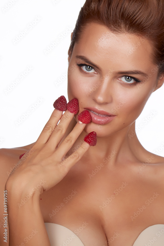 Beautiful sexy woman eating raspberries healthy food organic Beautiful sexy woman eating raspberries healthy food organic