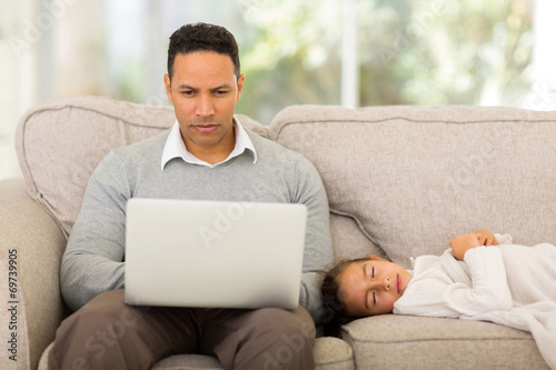 middle aged man using laptop at home