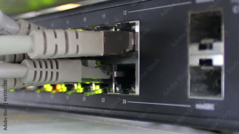 Modern network switch with cables and connectors. Modern network switch with cables and connectors.