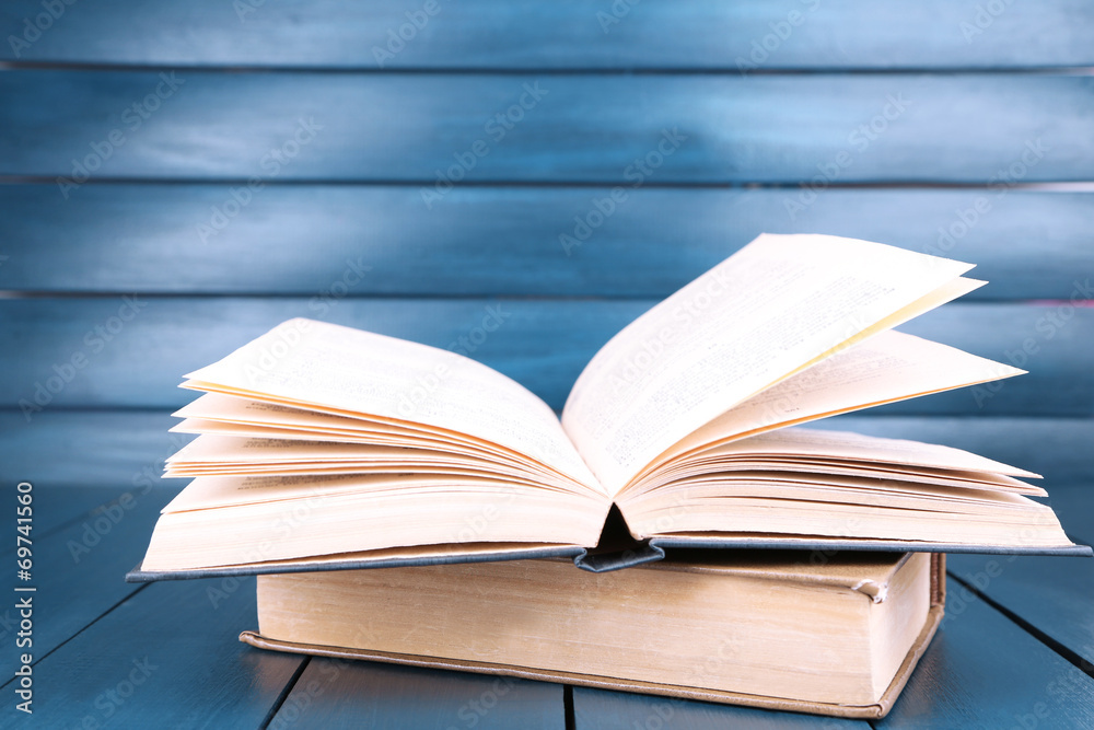 Fototapeta premium Books on dark blue wooden background