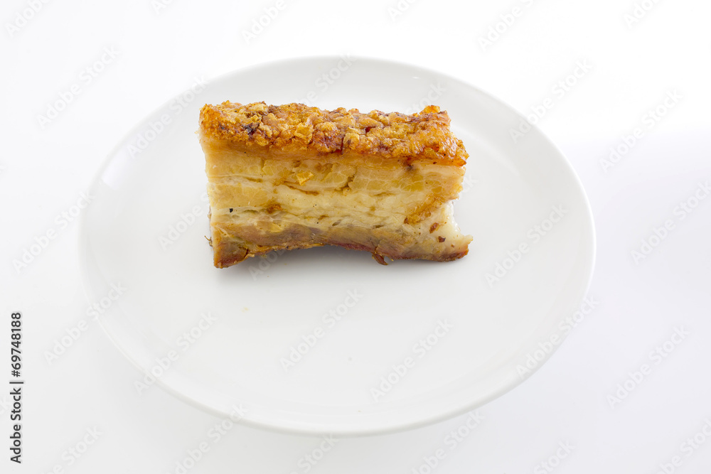 Freshly baked crispy pork belly on white background Freshly baked crispy pork belly on white background