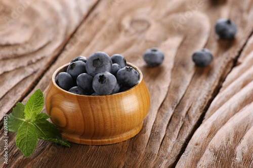 Fresh blueberries in a wooden bowl