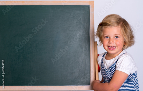 smiling girl with black board © Firma V