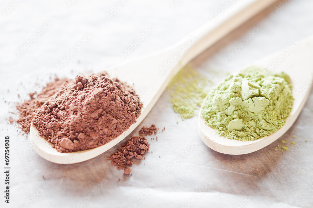 Spoon of cocoa and green tea powder Spoon of cocoa and green tea powder