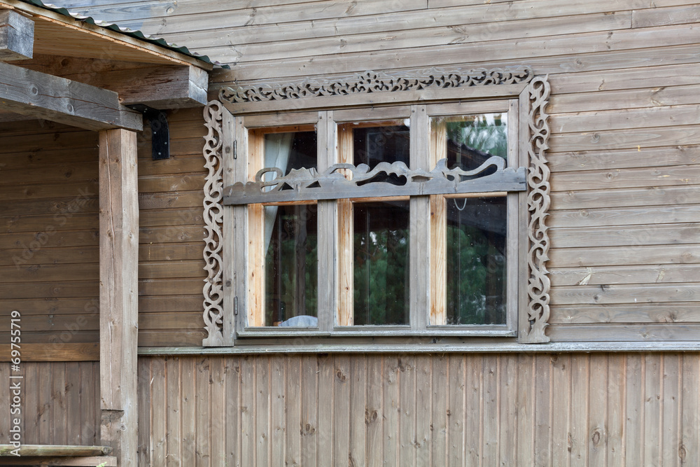 Wide wooden frame window of rural house, close-up Wide wooden frame window of rural house, close-up