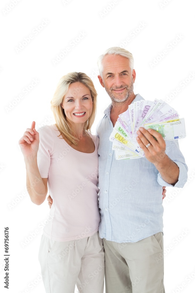 Happy couple flashing their cash Happy couple flashing their cash