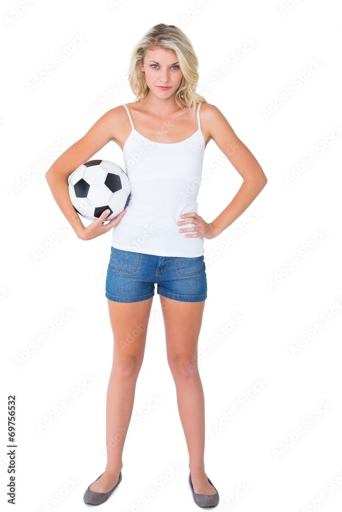Pretty blonde football fan holding ball Pretty blonde football fan holding ball