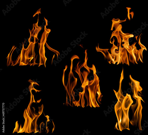 collection of five yellow flames isolated on black