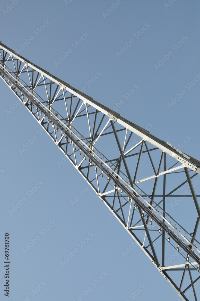 Construction of a telecommunications tower against the blue sky 