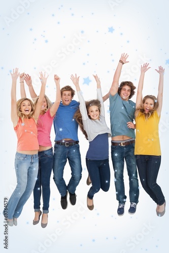 Composite image of celebrating friends jumping in the air