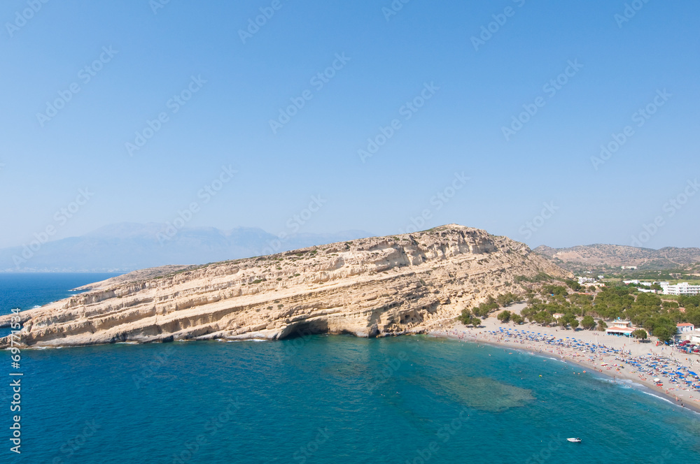 Panoramic view of Matala sandy beach on Crete, Greece.