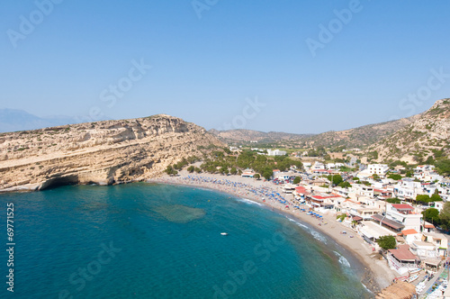 Matala sandy beach with caves near Heraklion town. Crete, Greece