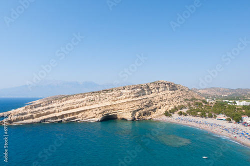 Panoramic view of Matala sandy beach on Crete, Greece.