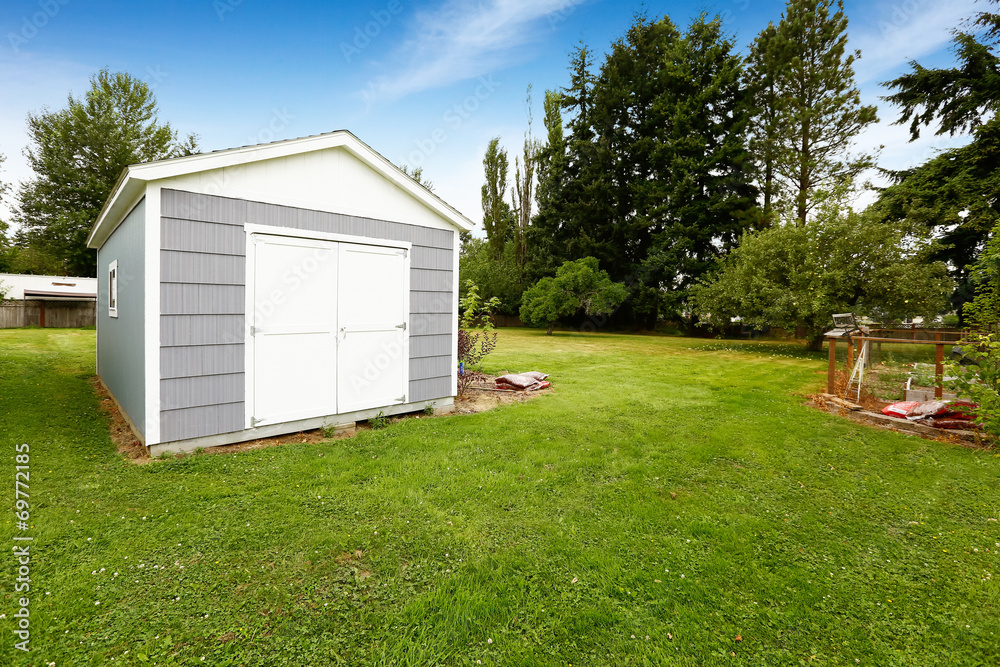 Small grey shed with white trim. Countryside real estate Small grey shed with white trim. Countryside real estate