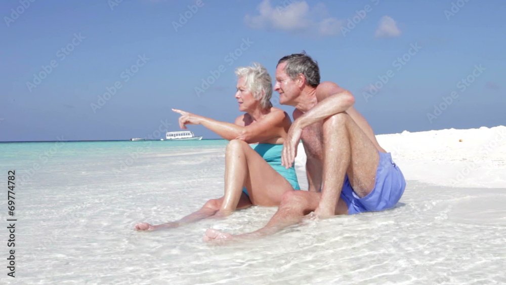 Senior Couple Enjoying Beach Holiday Senior Couple Enjoying Beach Holiday