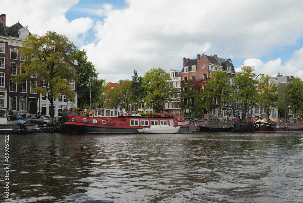 City channel and embankment. Amsterdam, Holland