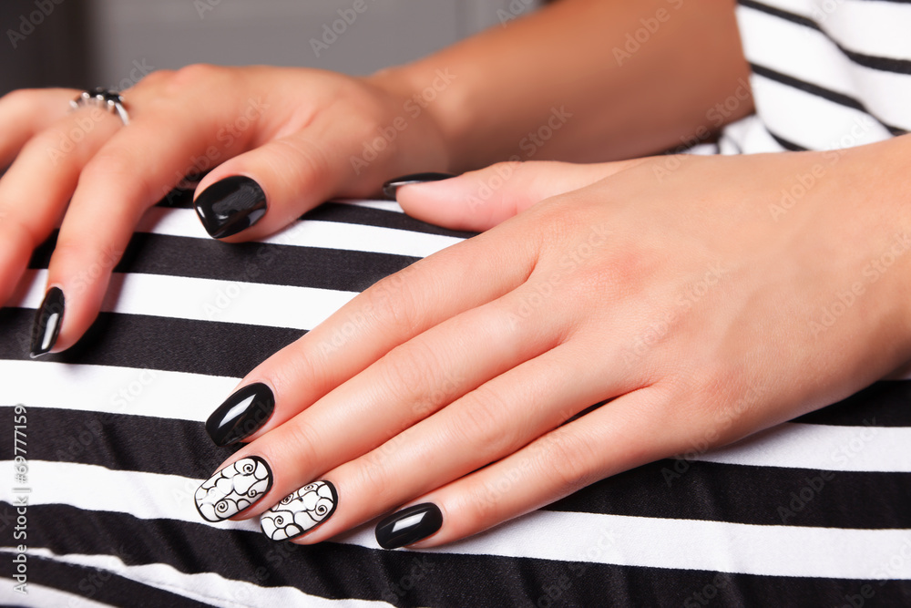 Portrait of beautiful nail art of manicured and painted fashion