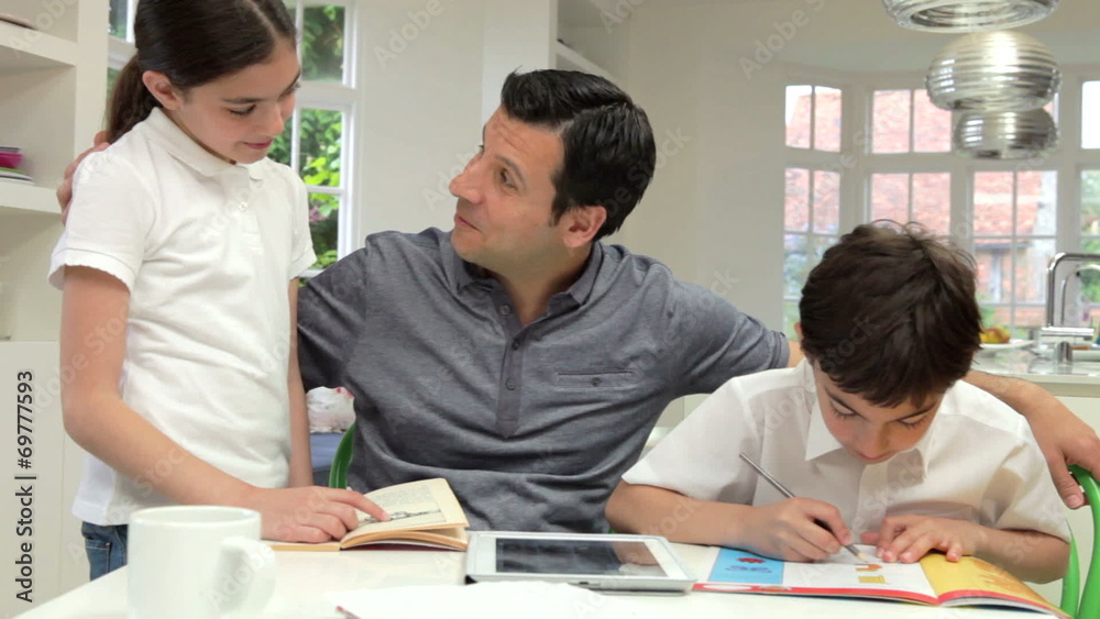 Father Helping Children With Homework Father Helping Children With Homework