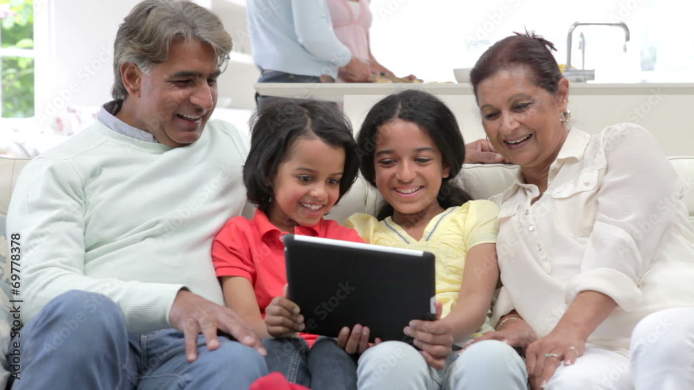 Multi-Generation Indian Family With Digital Tablet Multi-Generation Indian Family With Digital Tablet