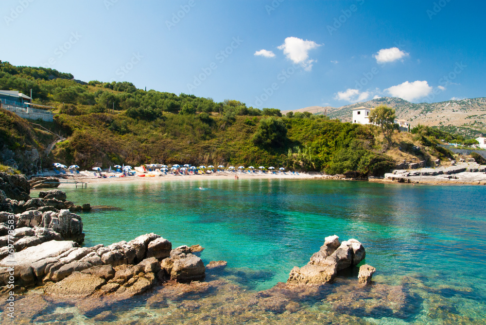 Kassiopi Beach, Corfu Island, Greece. Sunbeds and parasols